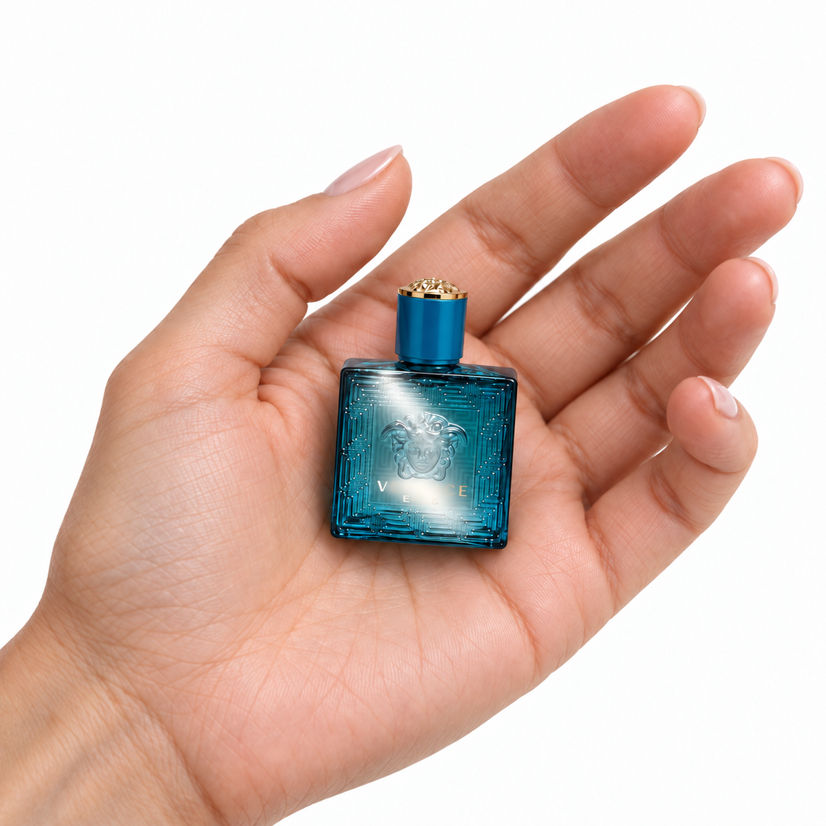 Mint Eclipse 5ml miniature resting in a palm on white