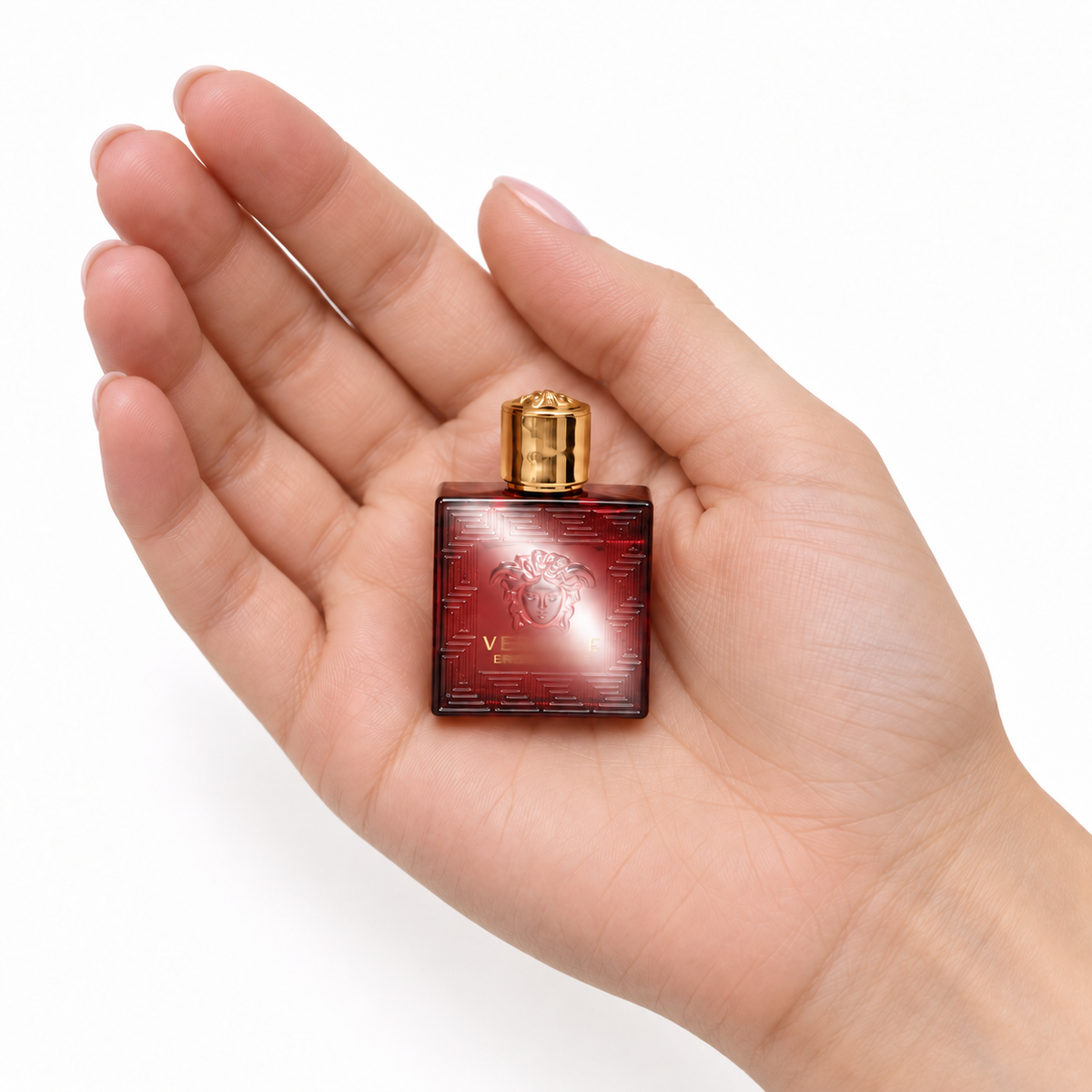 Ember Coast 5ml miniature resting in a palm on white