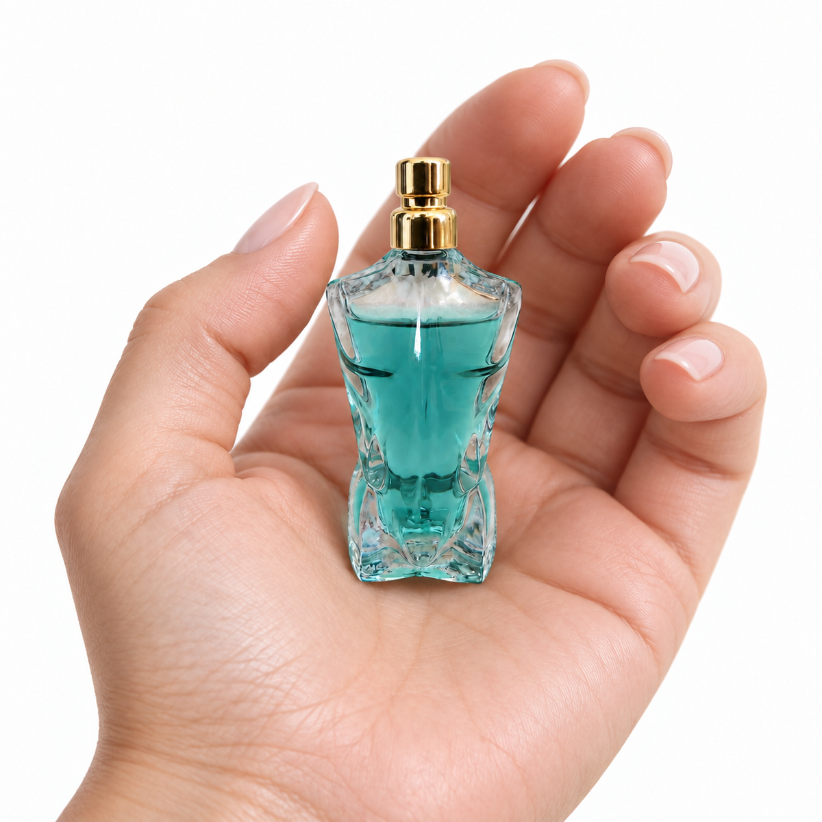Coconut Dusk 7ml miniature resting in a palm on white