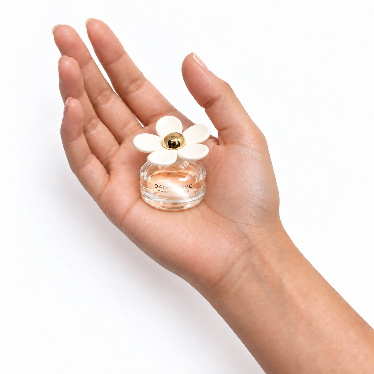 Cloudberry Kiss 4ml miniature resting in a palm on white