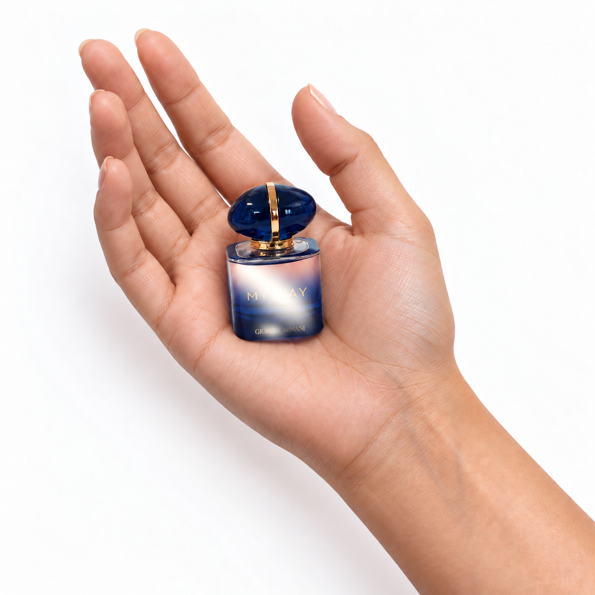 Iris Veil 7ml miniature resting in a palm on white