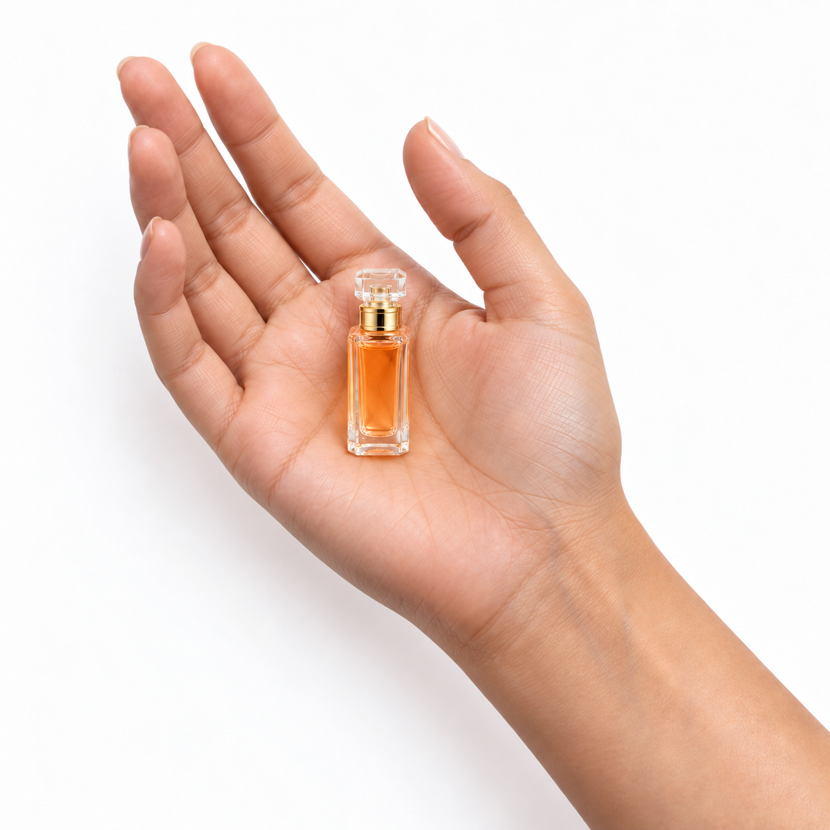 Amber Poise 7.5ml miniature resting in a palm on white