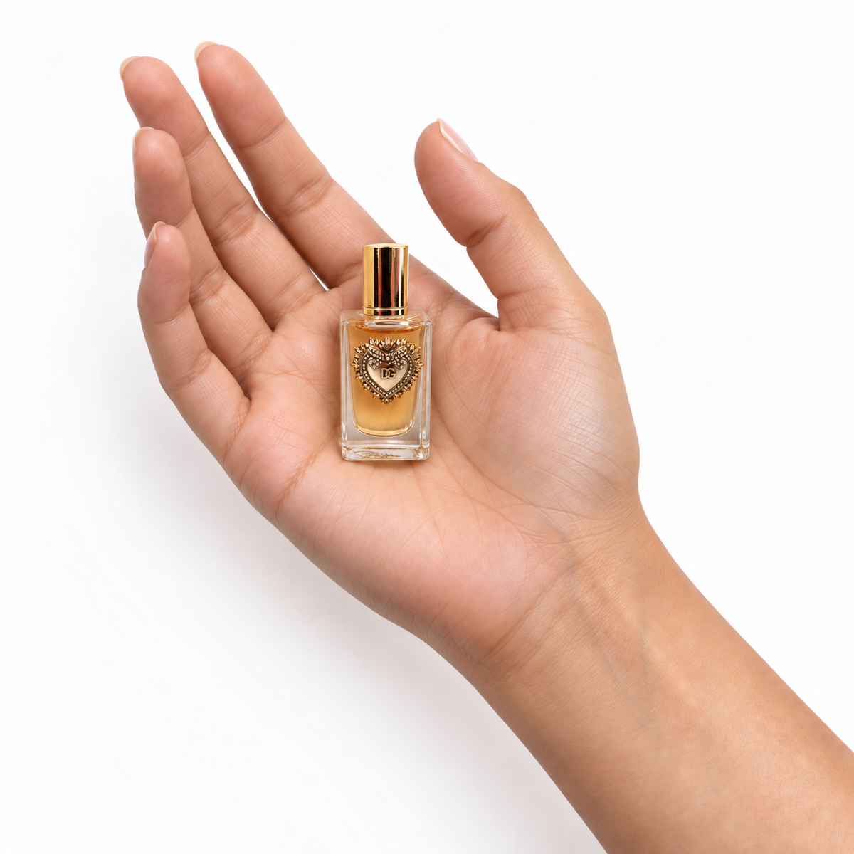 Citrus Soufflé 5ml miniature resting in a palm on white