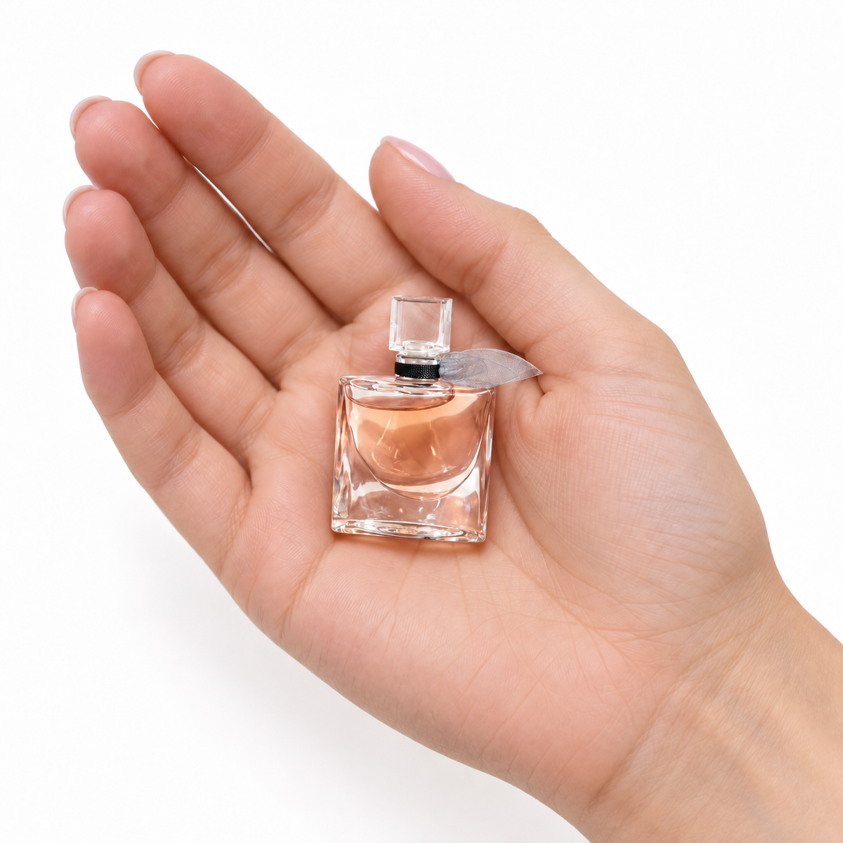 Iris Glacé 4ml miniature resting in a palm on white