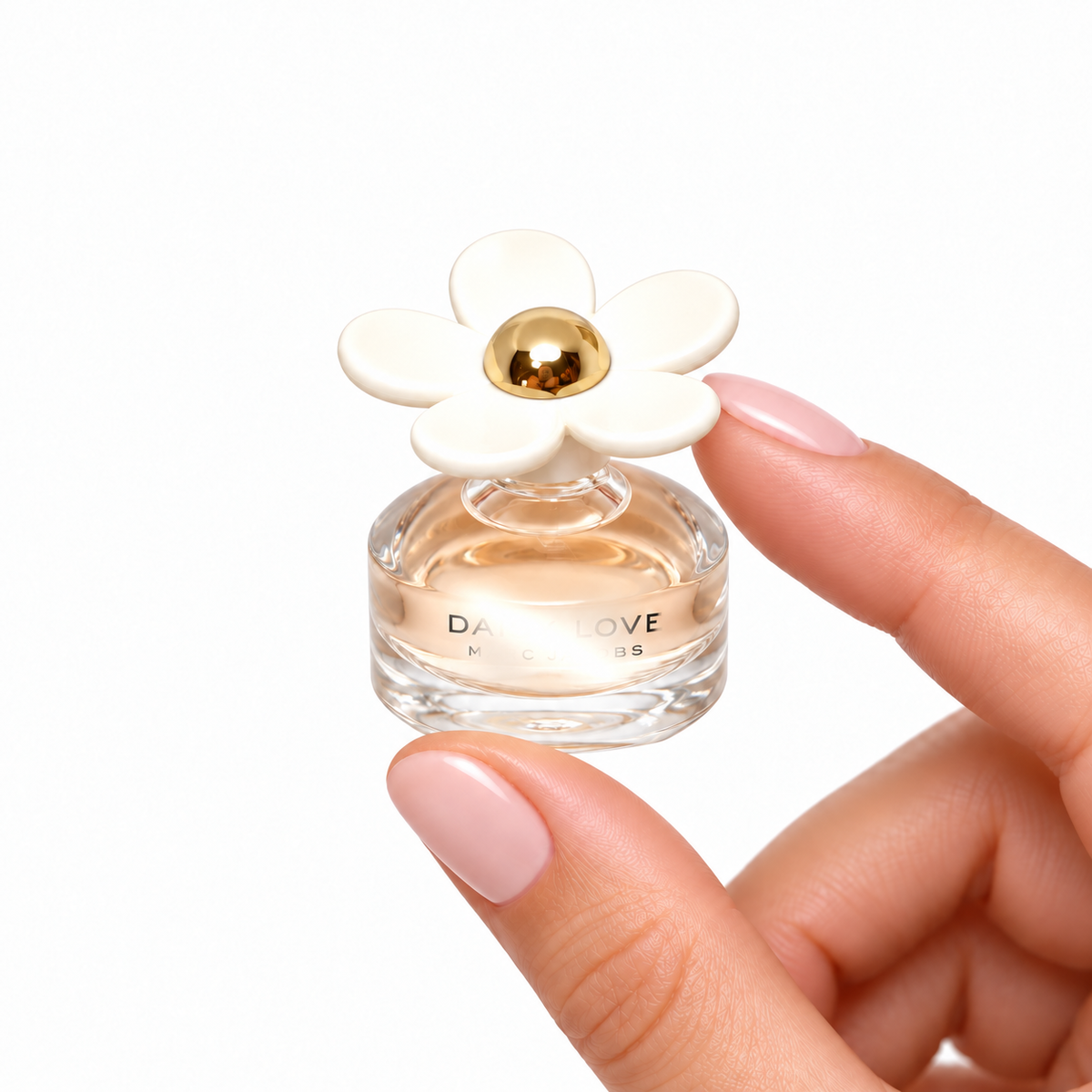 Cloudberry Kiss 4ml miniature held between fingertips on white