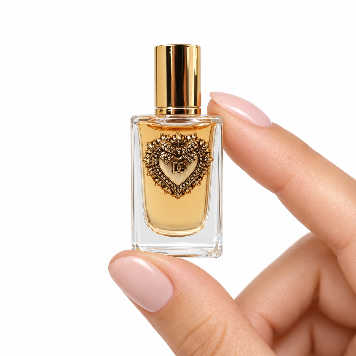 Citrus Soufflé 5ml miniature held between fingertips on white