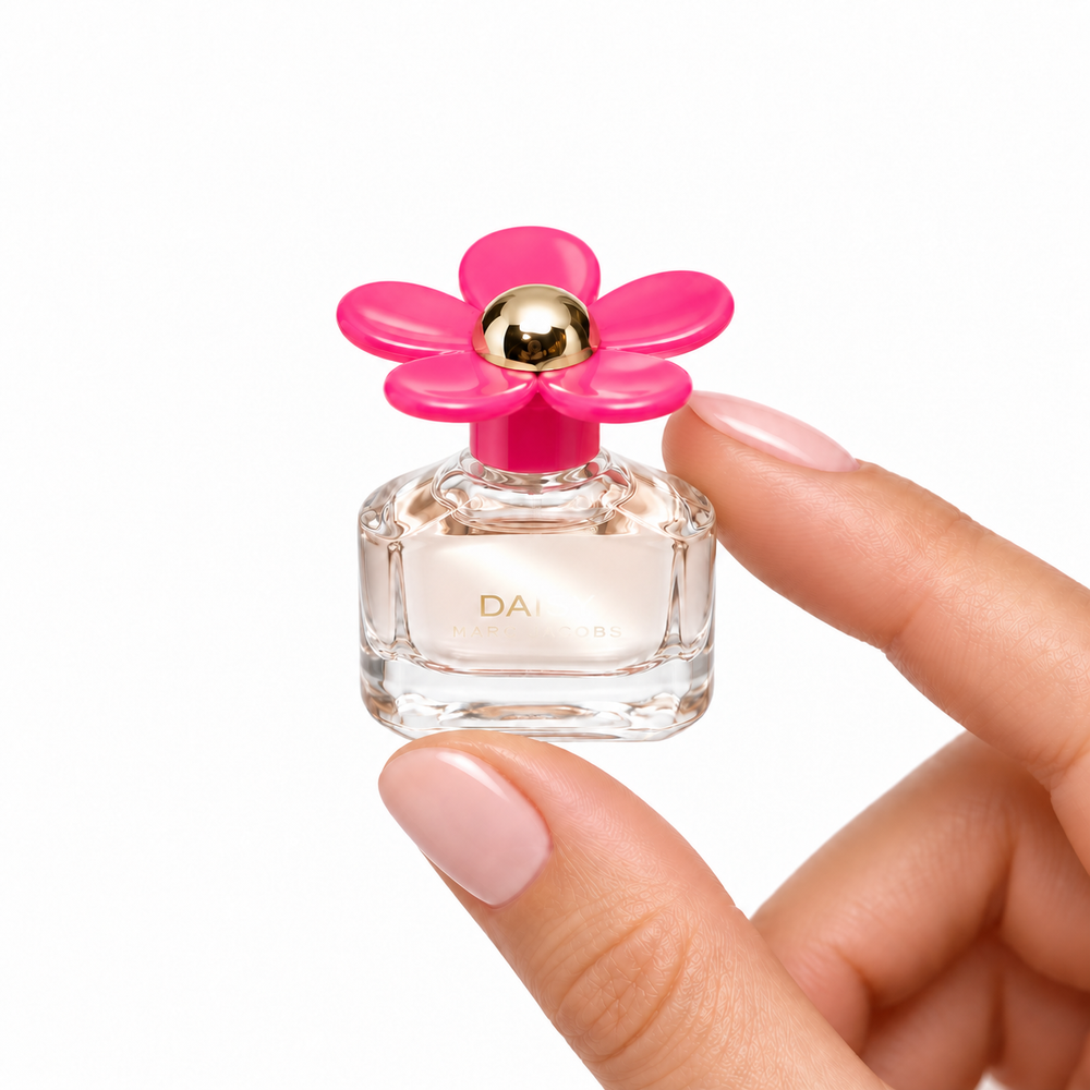 Berry Whim 4ml miniature held between fingertips on white